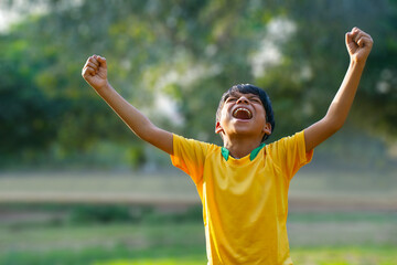 Wall Mural - Excited boy football player after goal scored	