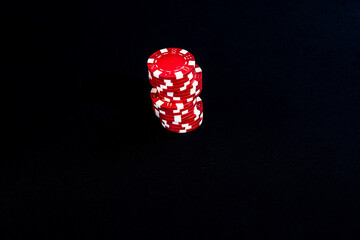 Sticker - Stack of poker chips on black background