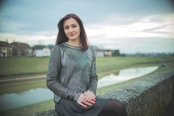 Poster - Young dark hair Caucasian female from Bosnia and Herzegovina sitting in the park