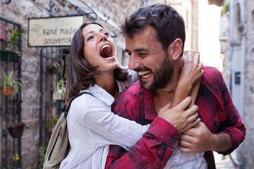 Wall Mural - Happy love couple walking in town