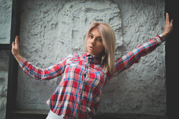 Poster - Young attractive Caucasian blond female from Bosnia and Herzegovina posing and stretching outdoors