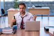 © Elnur - Young male alcohol addicted employee working in the office