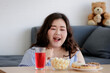 © Bangkok Click Studio - Happiness of Asian young sexy confidence smart beautiful long black hair oversized fat female model sit relax smiling enjoying food snack and drink on table in blurred foreground and background