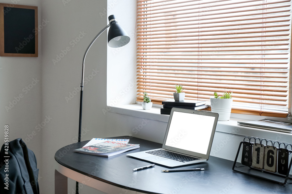 Interior of modern room with comfortable workplace
