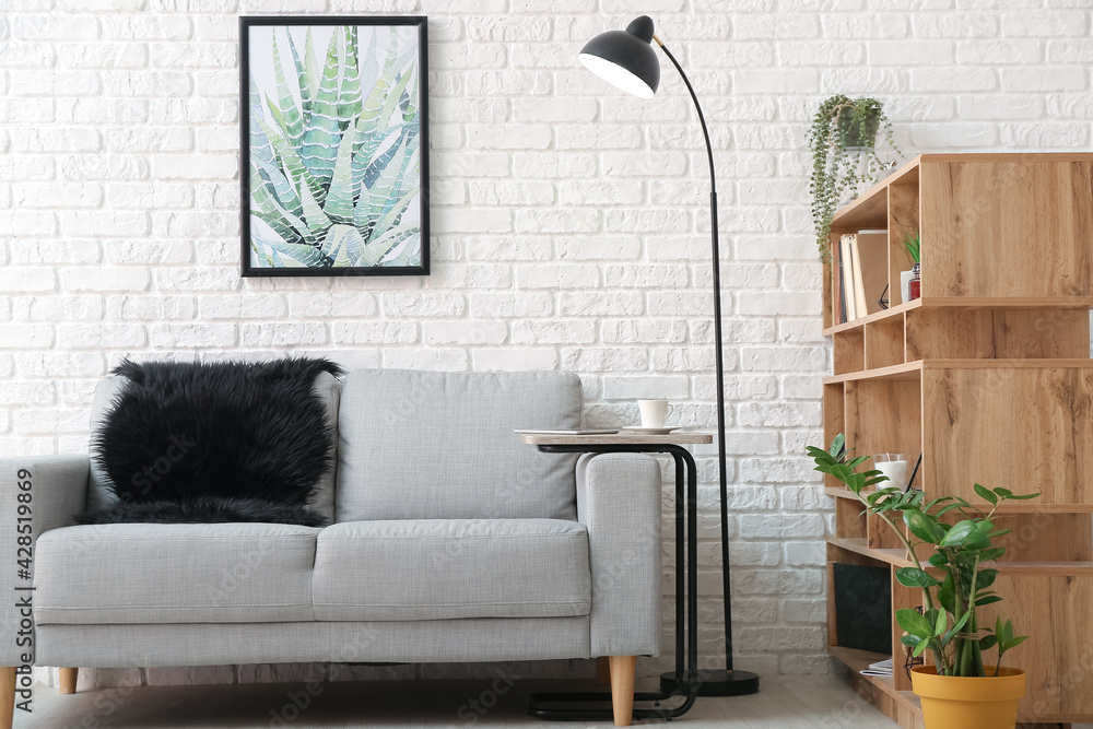 Interior of modern living room with lamp and sofa