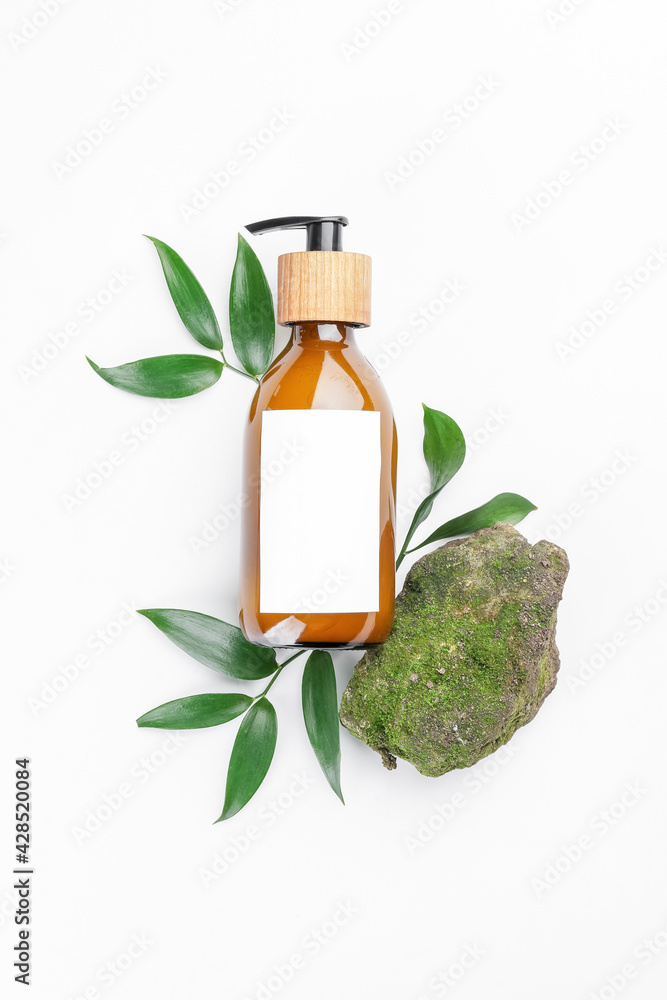 Bottle with natural shampoo on white background