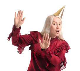 Wall Mural - Mature woman in party hat on white background