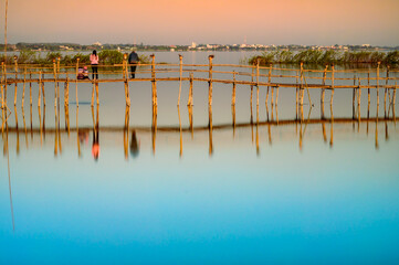 Wall Mural - Small Wooden Bridge with Soft Water in Kwan Phayao Lake