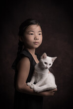 Classic Painterly Portrait Of A Little Girl In Black  With A White Cat