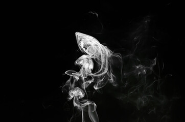 abstract fragment movement of white smoke on black background.