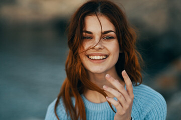 cheerful red-haired woman outdoors recreation travel close-up