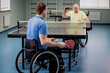© romaset - Adult disabled men in a wheelchair playing table tennis