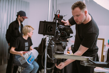 Wall Mural - Director of photography with a camera in his hands on the set.