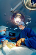 © Vadim - Couple of professional surgical doctors working with patient. Pandemic surgery work.