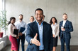 © Prostock-studio - Successful African American Businessman Stretching Hand For Handshake In Office