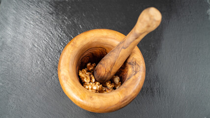 Wall Mural - Olive wood mortar with pestle for crushing nuts