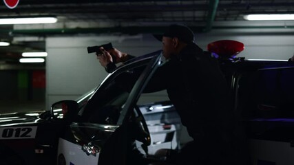 Canvas Print - Policeman getting out of patrol car. Cops aiming with guns behind police vehicle