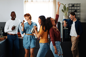 Women having fun in a friend's kitchen