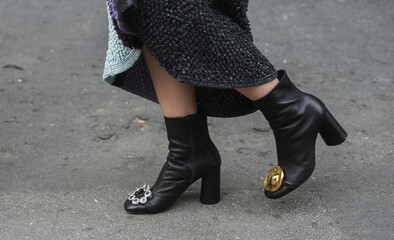 Wall Mural - Detail of a fashionable outfit – woman wearing black shoes