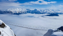 Above The Clouds. Suspension Bridge In The Mountains. Sochi, Russia