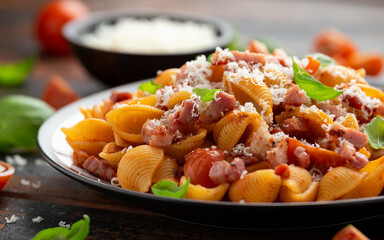 Wall Mural - Conchiglie alla Amatriciana pasta with pancetta bacon, tomatoes and pecorino cheese. Healthy Italian food