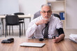 © Elnur - Aged male employee suffering at workplace