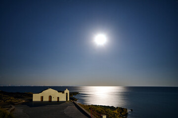 Sticker - The facade of the Orthodox chapel illuminated by moonlight on the coast of the island of Zakynthos