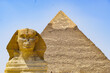 The Sphynx and the Pyramid of Keops at the Giza plateau , near Cairo 