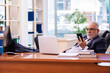 © Elnur - Old businessman employee working in the office