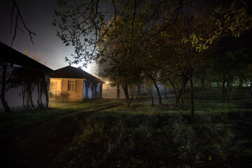 Wall Mural - mountain night landscape of building at forest at night with moon or vintage country house at night 