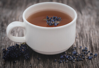 Canvas Print - Lavender tea with flower on natural surface