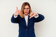 © Asier - Young business caucasian woman isolated on white background showing thumbs up and thumbs down, difficult choose concept
