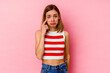 © Asier - Young caucasian woman isolated on pink background crying, unhappy with something, agony and confusion concept.