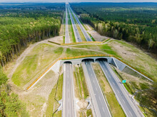 Expressway With Ecoduct Crossing - Bridge Over A Motorway That Allows Wildlife To Safely Cross Over The Road, Aerial Top Down View