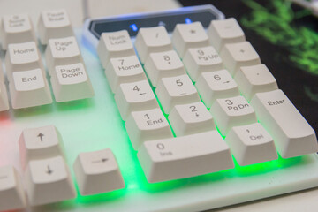 white gamer keyboard with colorful lights in rio de janeiro.