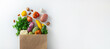 © Vasiliy - Healthy food background. Healthy vegan vegetarian food in paper bag vegetables and fruits on white, copy space. Shopping food supermarket and clean vegan eating concept