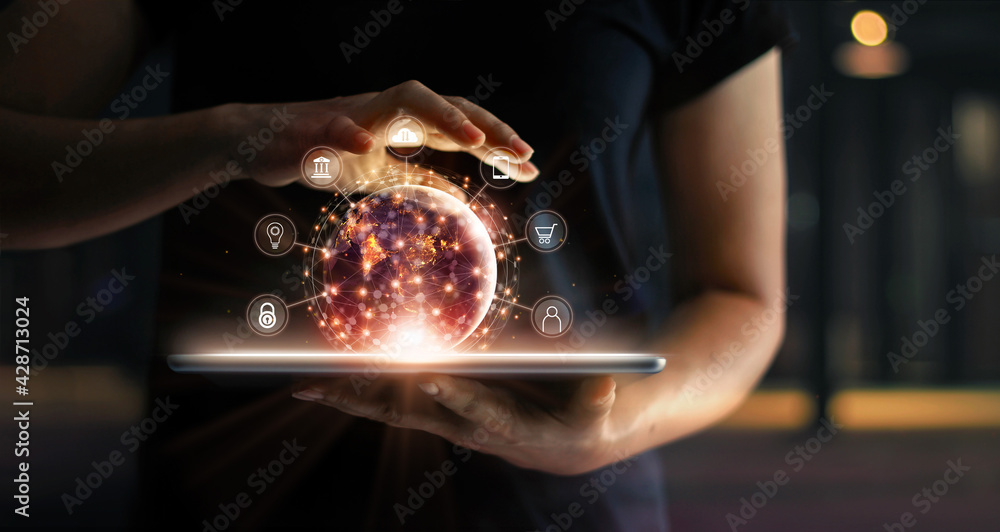 Man holding virtual globe with marketing network connecting icons on tablet. Innovation technology develop sustainable future service and smart solution in global business. - obrazy, fototapety, plakaty 