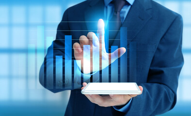 Businessman with tablet computer using virtual screen in office. Concept of business planning