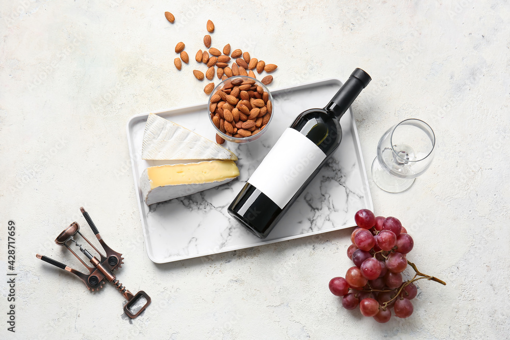 Composition with bottle of wine on grunge background