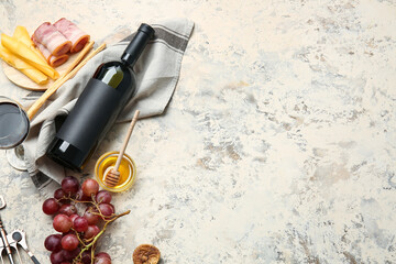 Composition with bottle of wine on grunge background