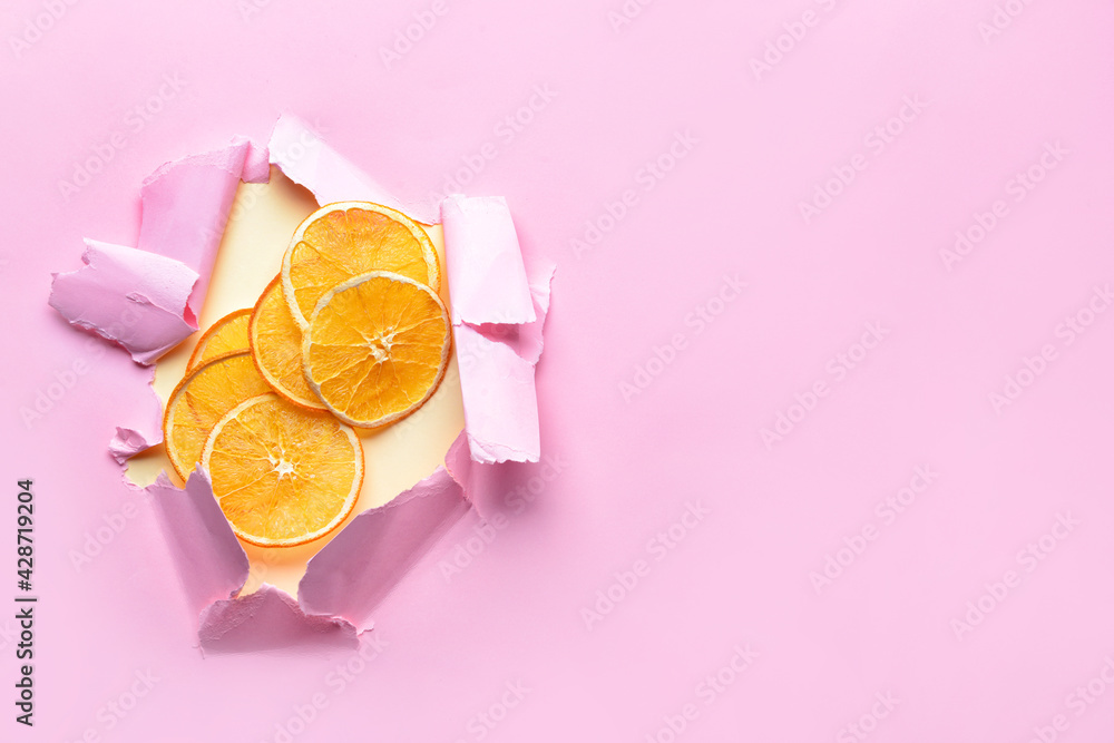 Dried orange slices on color background