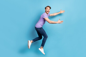 Poster - Full body profile photo of astonished crazy person open mouth arms wait catch isolated on blue color background