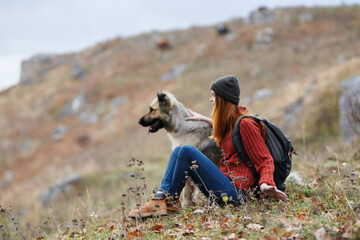 woman in mountains outdoors with dog friendship travel landscape