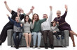 © ASDF - happy family sitting on a large comfortable sofa.
