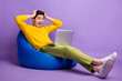© deagreez - Full body profile photo of astonished person hands on head open mouth staring netbook isolated on violet color background