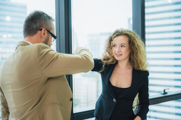 Canvas Print - professional business person meeting and talking, businesswoman and businessman teamwork working in modern office, shaking hand in successful business concept