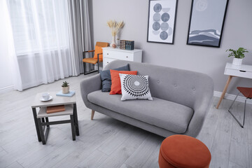 Poster - Stylish grey living room interior with comfortable sofa