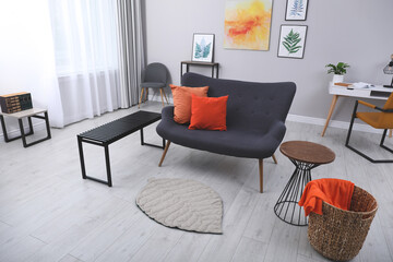 Sticker - Stylish living room interior with comfortable grey couch