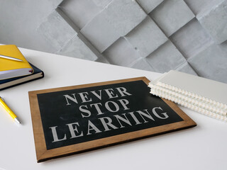 Wall Mural - Never stop learning on the blackboard about lifelong education.