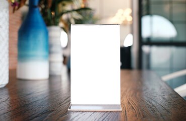 Menu frame standing on wood table in Bar restaurant cafe. space for text marketing promotion.